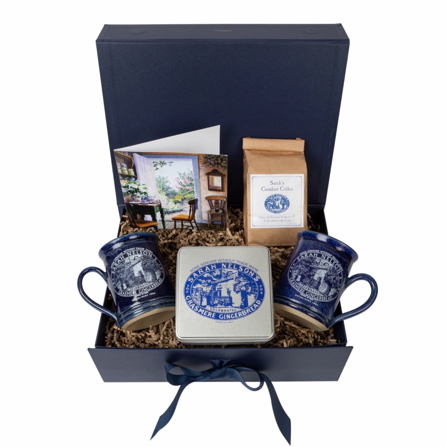 A navy presentation gift box of Grasmere Gingerbread with branded mugs and coffee